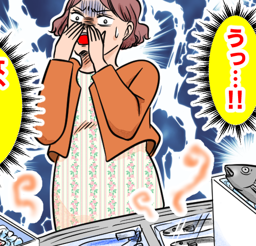 妊娠中の女性がスーパーの鮮魚コーナーのにおいが耐えられずショックを受けている様子